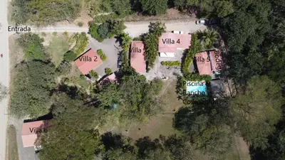 an overhead view of an estate with trees and buildings at Villasjungle 1 in Sámara