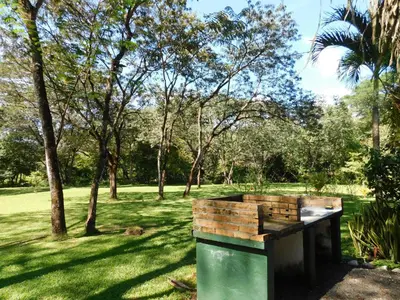 a water tank in a park with trees at Villasjungle 2 in Sámara