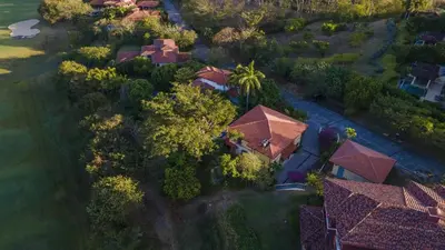 an overhead view of a house with trees and roofs at Villa Zindagi Luxury Villa Private Pool - Reserva Conchal in Playa Conchal