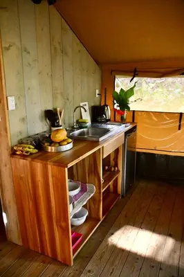 a kitchen with a sink and a counter in a room at El Pulpo Safari Lodge in Ojochal