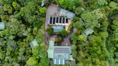 an aerial view of a house in the forest at Ávita Lodge in Quesada