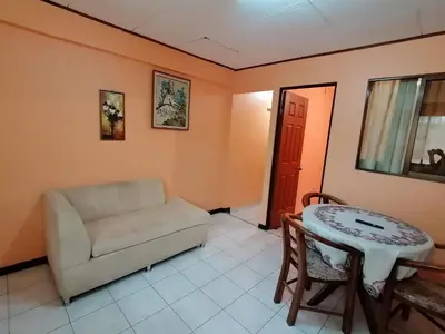 a living room with a couch and a table at Marta's Guesthouses, apartamentos con entrada autonoma in Puerto Limón