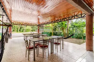 a group of tables and chairs on a patio at Rio Danta in Fortuna
