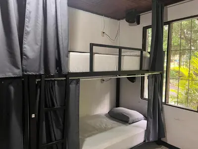 a bunk bed in a room with a window at Rio Danta in Fortuna