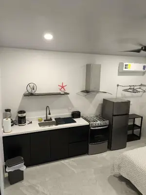 a kitchen with a sink and a stove at MADRE TERRA in Uvita
