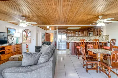 a living room with a couch and a table at Flamingo Marina Resort 413 in Playa Flamingo