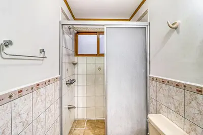 a bathroom with a shower with a glass door at Flamingo Marina Resort 413 in Playa Flamingo