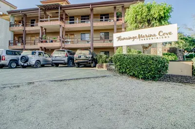a parking lot in front of a hotel at Flamingo Marina Resort 413 in Playa Flamingo