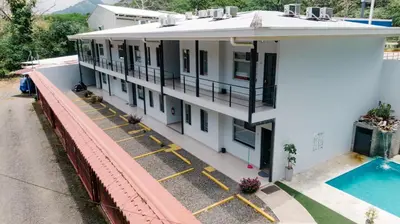 an overhead view of a building with a swimming pool at Apartamentos Ganesha Jacó in Jacó