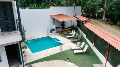 an overhead view of a swimming pool in a house at Apartamentos Ganesha Jacó in Jacó