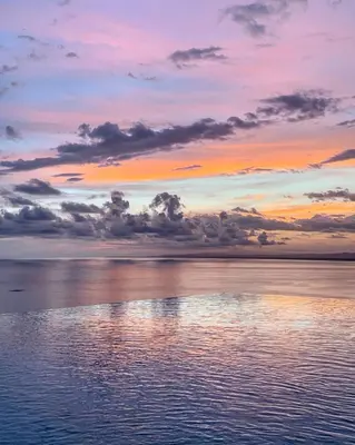 a sunset over a body of water at Makanda by The Sea Hotel Adults Only in Manuel Antonio