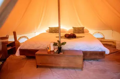 a bedroom with a bed in a tent at Seren Glamping in Uvita