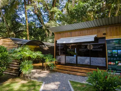a shop with a sign in front of it at Seren Glamping in Uvita
