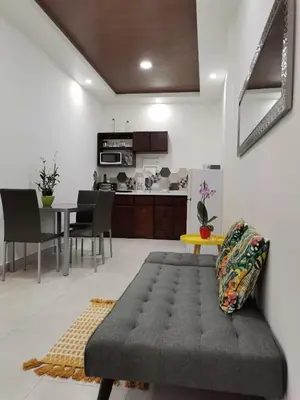 a living room with a table and a couch at 935 Lodge San José in San José