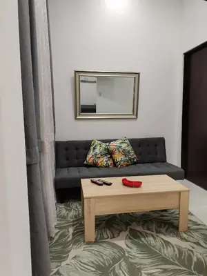 a living room with a couch and a coffee table at 935 Lodge San José in San José