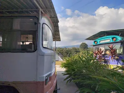 an old bus is parked next to a building at Combi Bus Dreamcatcher in Sarchí