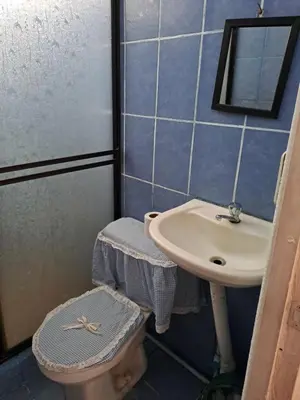 a bathroom with a sink and a toilet at Casa Los Ángeles in Ángeles
