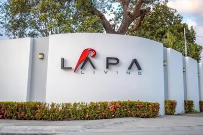 a sign for a laax living building at Jaco Lapa Living F2 in Jacó