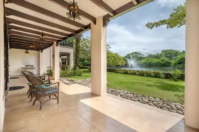 an outdoor patio with a view of a fountain at Dream House in prestigious Hacienda Pinilla in Tamarindo