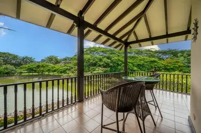 a patio with a table and chairs on a balcony at Dream House in prestigious Hacienda Pinilla in Tamarindo