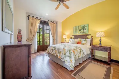 a bedroom with a bed and a ceiling fan at Dream House in prestigious Hacienda Pinilla in Tamarindo