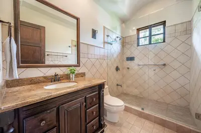 a bathroom with a sink and a shower and a toilet at Dream House in prestigious Hacienda Pinilla in Tamarindo