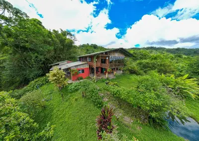 a house on the side of a hill at Birds & Breakfast Costa Rica in Fortuna