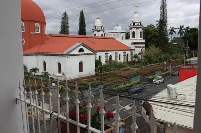 a view of a church from the balcony of a building at Park View Hotel & Restaurant in Alajuela City