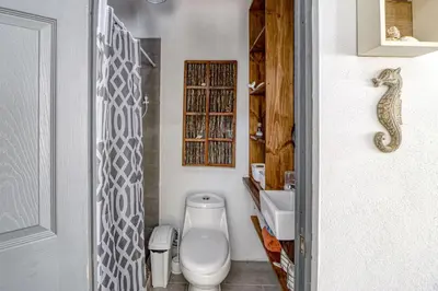 a bathroom with a toilet and a sink at Casa Conchas in Carrillo