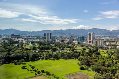 an aerial view of a city with a park at Hilton San Jose La Sabana in San José