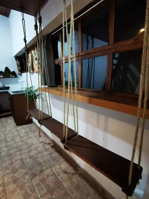 a porch swing in the kitchen of a house at Cabaña Hamacas in Cartago