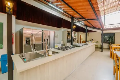 a kitchen with a counter with a stove top at Ocotal Beach House in Sardinal