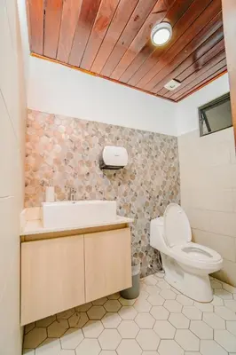 a bathroom with a toilet and a sink at Ocotal Beach House in Sardinal