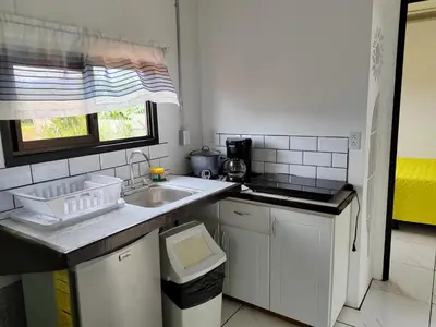 a small kitchen with a sink and a window at Hospedaje Eli 09 in Pavones