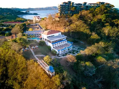 an aerial view of a building on a hill at Dunama Ocean View Hotel in Playa Flamingo