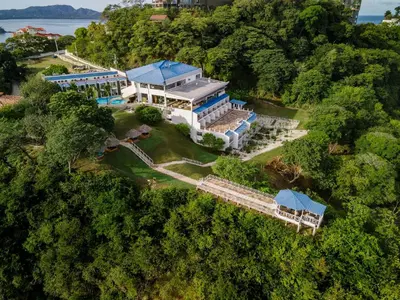 an aerial view of a house with a train station at Dunama Ocean View Hotel in Playa Flamingo