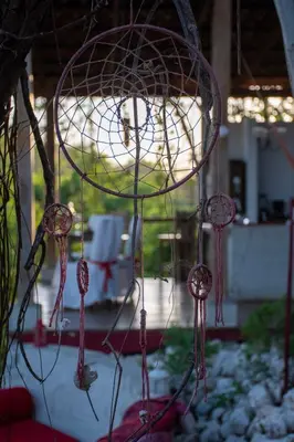 a bunch of pink meat hanging from a cage at Marbella Retreats Casa Roja in Santa Cruz