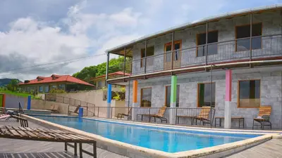 a swimming pool in front of a building at Monte Terras in Tronadora