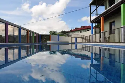 a swimming pool with a reflection of the sky at Monte Terras in Tronadora