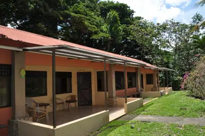 a house with a porch with chairs and tables at Monte Terras in Tronadora