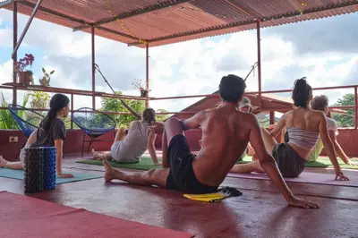 a group of people sitting in a yoga class at Villas Jacquelina in Quepos