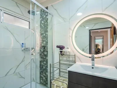 a bathroom with a sink and a mirror at Vista Ballena in Uvita