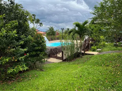 a swimming pool with a slide in a yard at Legacy Boutique Hotel in Quesada