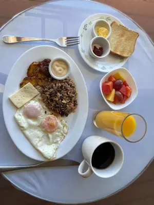 a plate of breakfast food on a table at Legacy Boutique Hotel in Quesada