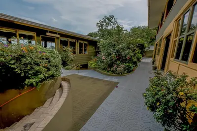 a building with some plants on the side of it at Hotel Don Taco in Monteverde Costa Rica