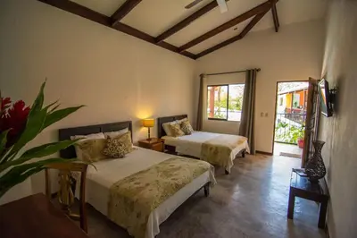 a bedroom with two beds in a room at Conchal Hotel in Brasilito
