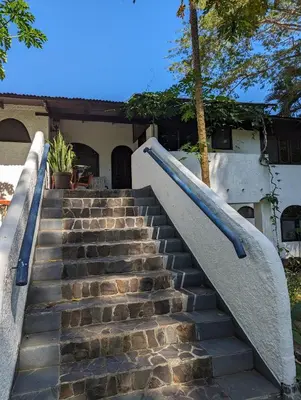 a set of stairs in front of a house at spirit of jungle lodge in Sámara