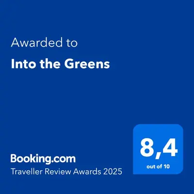 a blue screen with the text awarded to into the greens at Into the Greens in Madre de Dios