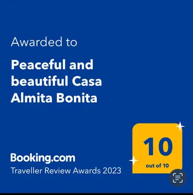a yellow sign with the text awarded to peaceful and beautiful caza ethnicbombinia at Peaceful and beautiful Casa Almita Bonita in Sámara