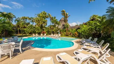 a pool with chaise lounge chairs and a bunch at Hotel Lavas Tacotal in Fortuna